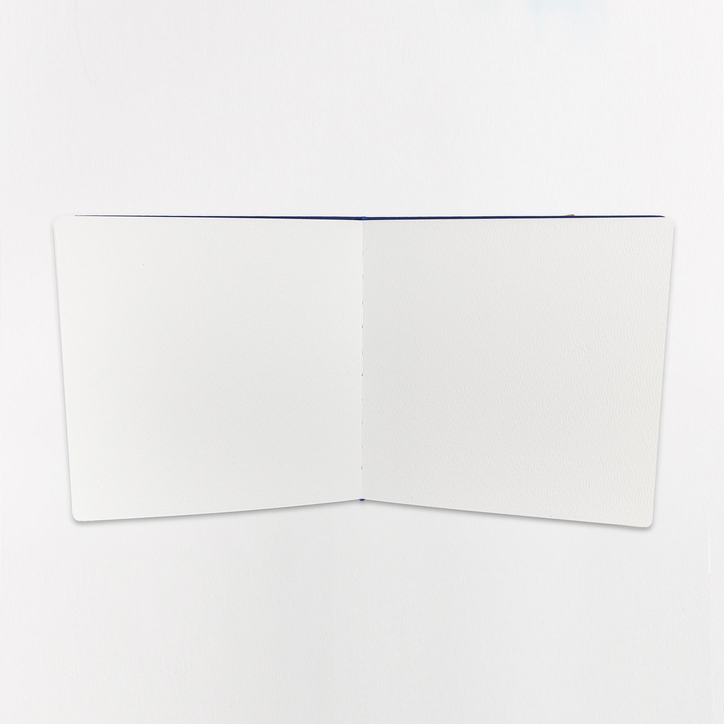 Open sketchbook showing blank interior pages