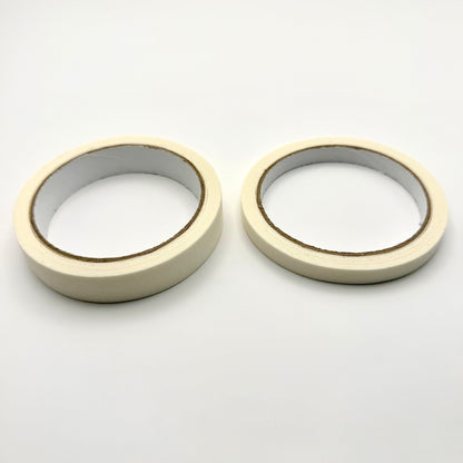Two rolls of white tape on a white background