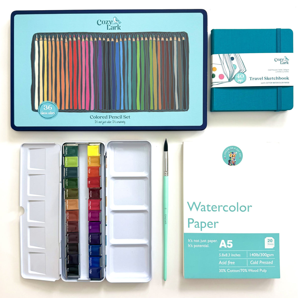 Cozy Lark watercolor painting kit including a 36-color colored pencil set, watercolor paints in a metal tin, a travel sketchbook, A5 watercolor paper, a paintbrush, and a palette, arranged on a white background.
