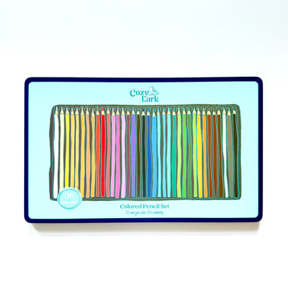 Set of colored pencils in a box with Cozy Lark branding on a white background