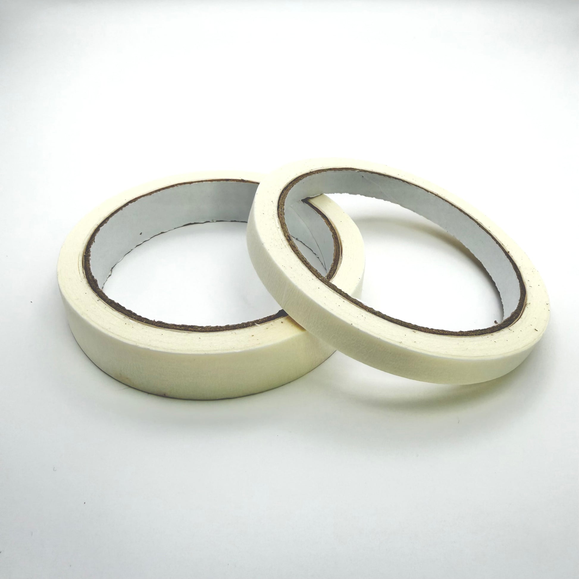 A roll of 10mm tape and a roll of 18mm tape on a white background