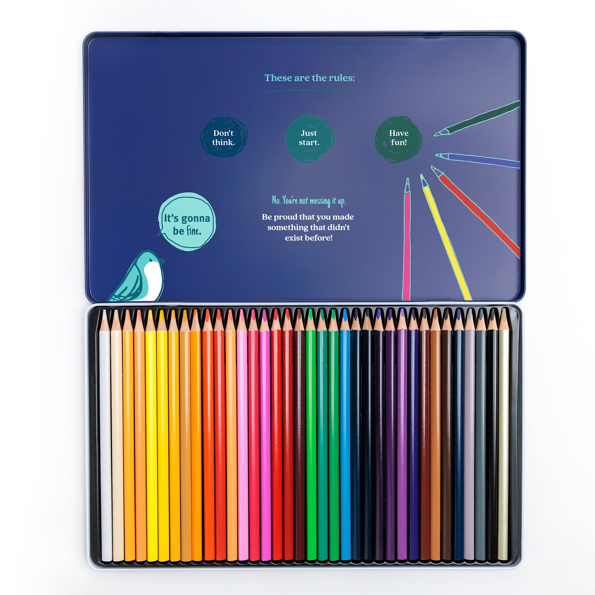Open set of 36 colored pencils with motivational copy in the inside cover on a white background