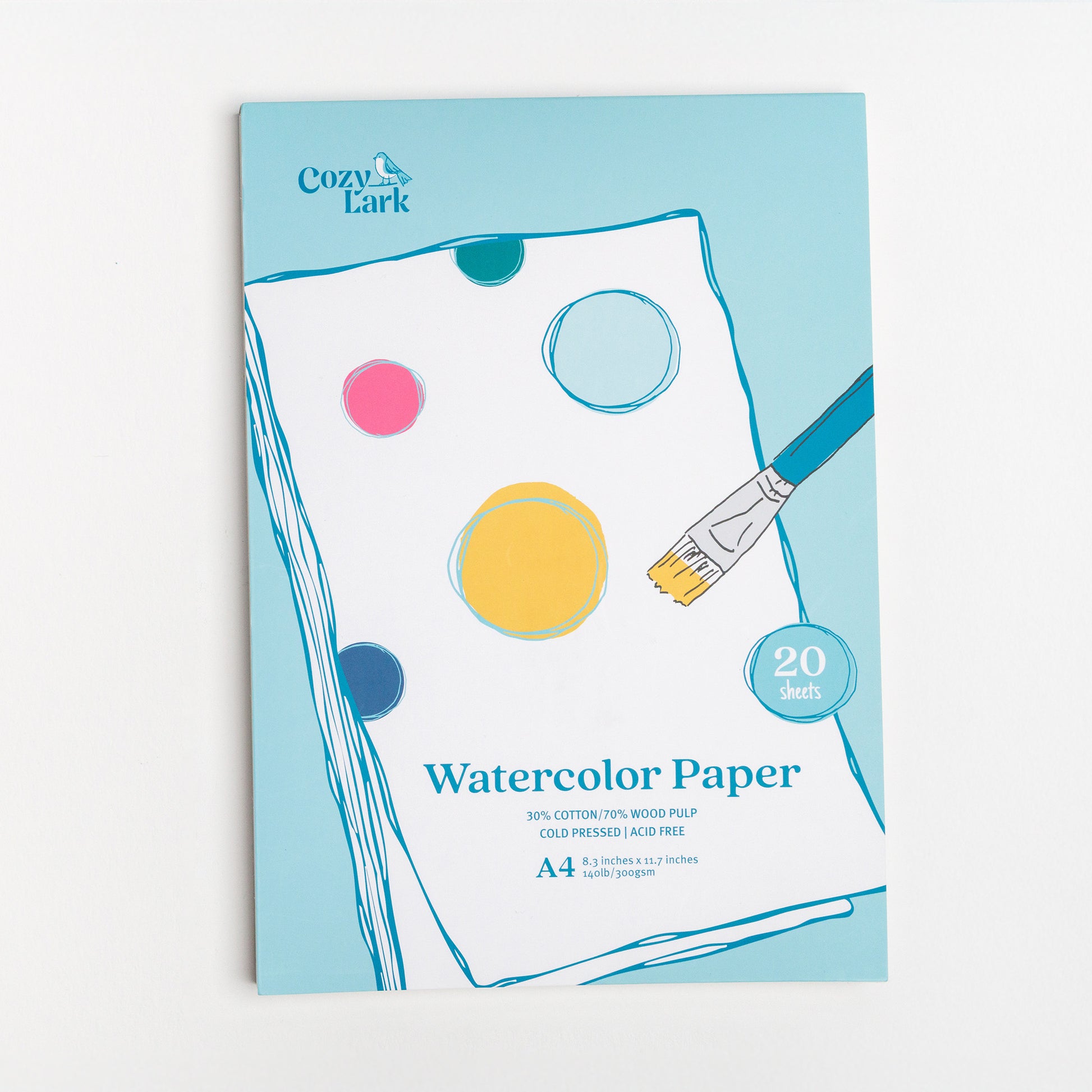 Cozy Lark A4 Watercolor Paper pad with illustrated paint circles and brush on blue cover