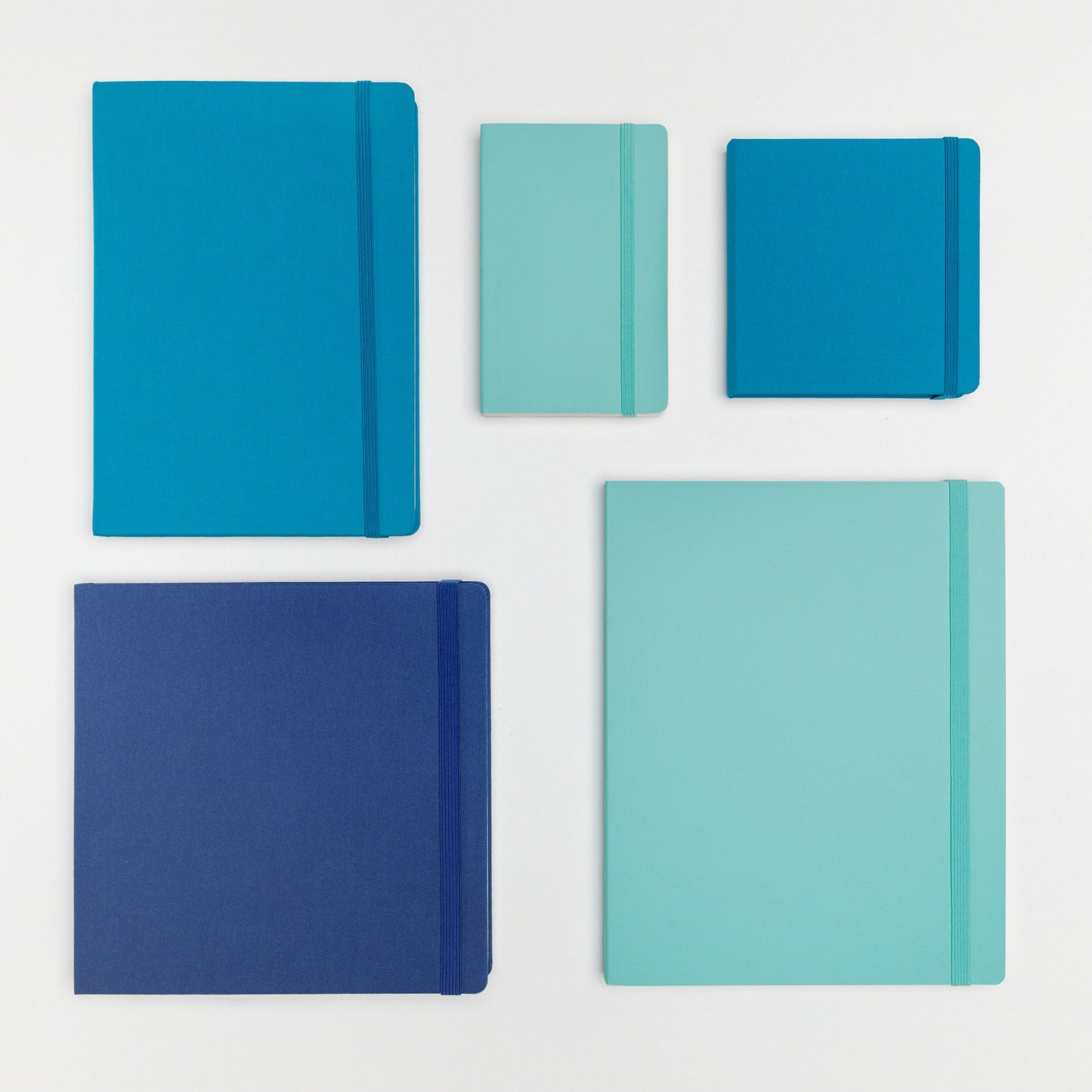 Large bundle of five books in beautiful shades of blue with a variety of hard and soft covers with elastic closure