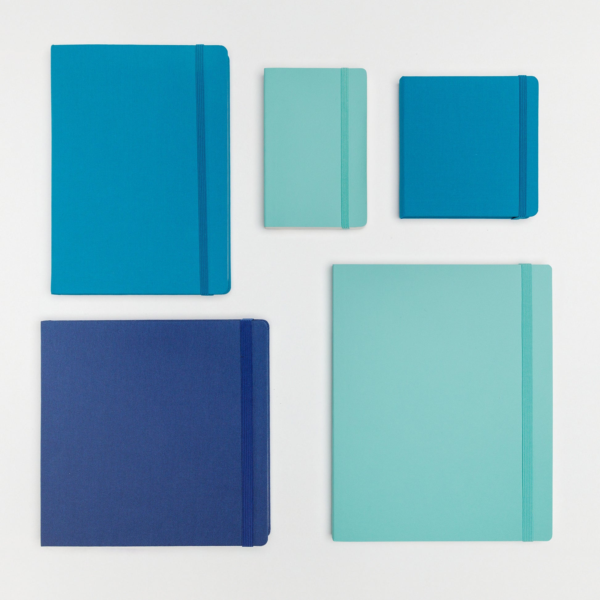 Large bundle of five books in beautiful shades of blue with a variety of hard and soft covers with elastic closure