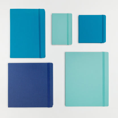 Large bundle of five books in beautiful shades of blue with a variety of hard and soft covers with elastic closure