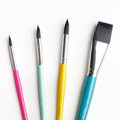 Close up of essential watercolor brushes including Size 6 round, size 8 round, size 10 round and 1 inch flat brushes