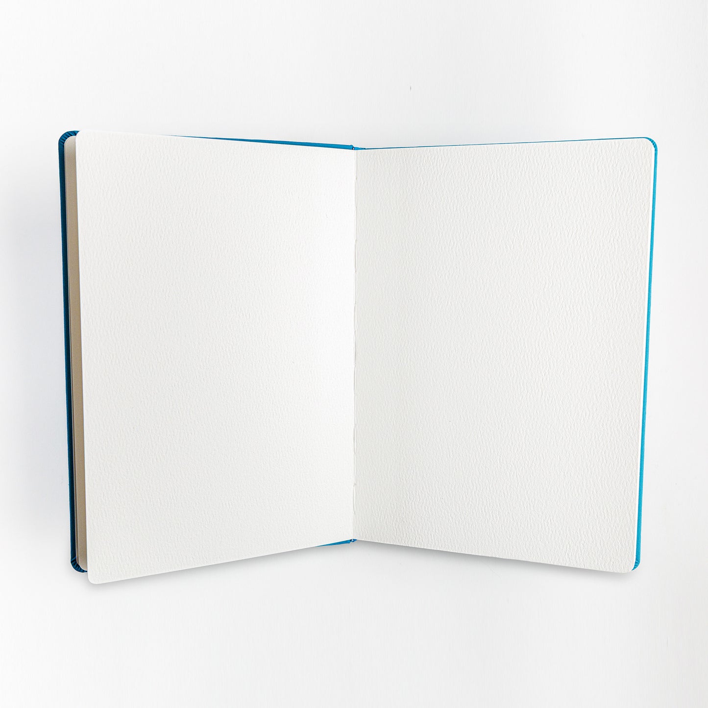 Open sketchbook showing blank interior pages