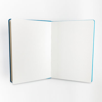 Open sketchbook showing blank interior pages