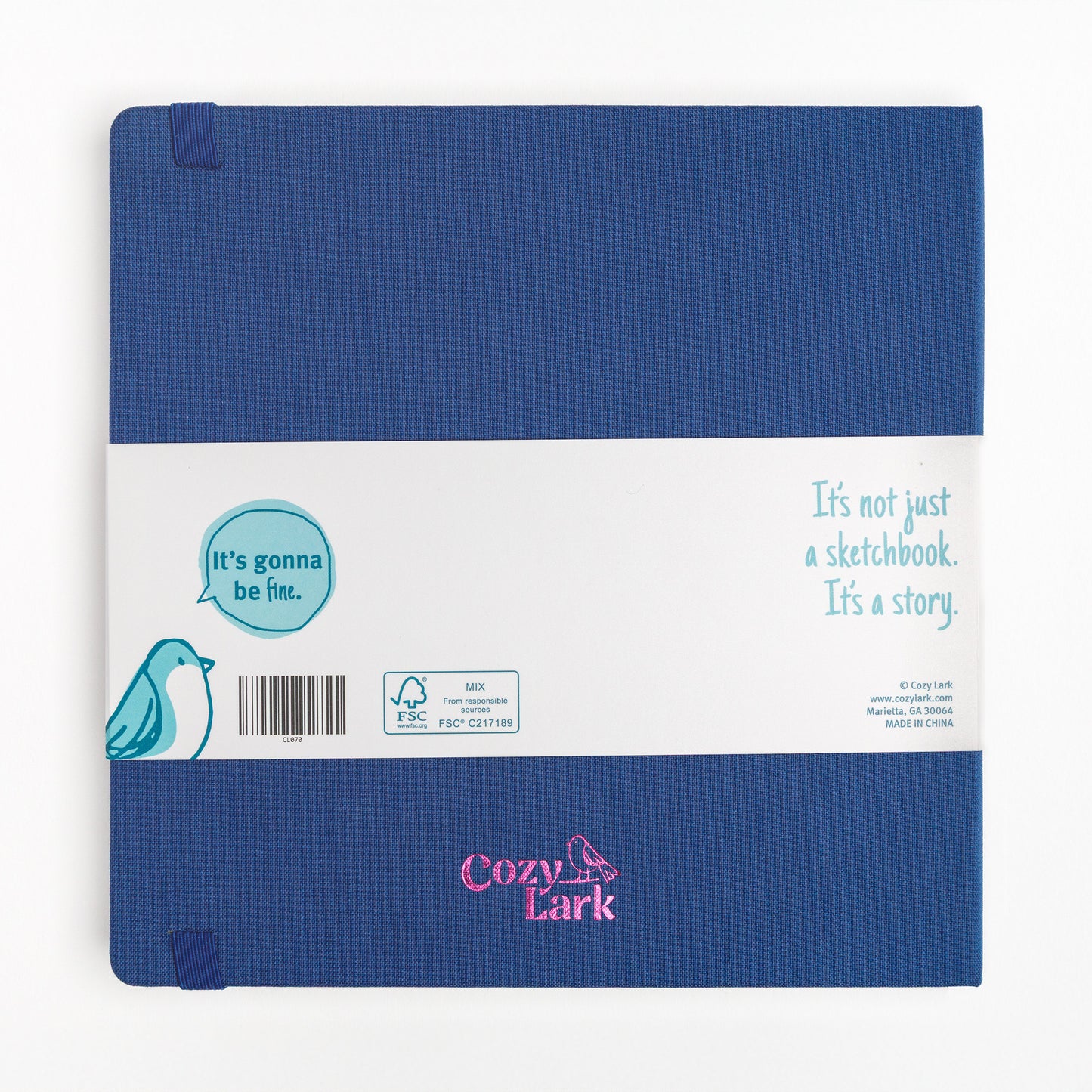 Back cover of large sketchbook with hard cover and bellyband showing pink metallic "Cozy Lark" imprint 