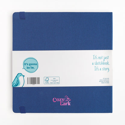 Back cover of large sketchbook with hard cover and bellyband showing pink metallic "Cozy Lark" imprint 