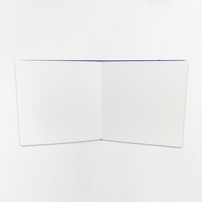 Open sketchbook showing blank interior pages
