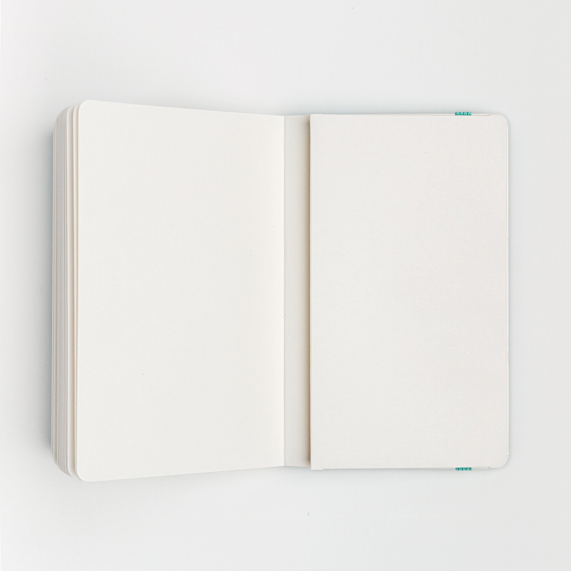 Watercolor sketchbook open to back cover inside pocket