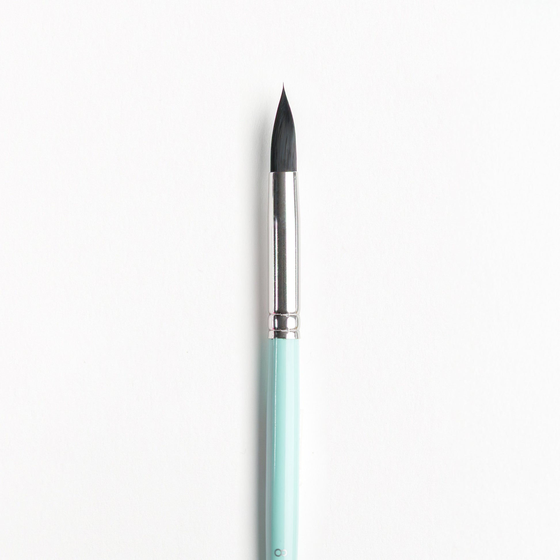 Close up of Size 8 watercolor brush with dark bristles, silver ferrule, and light turquoise handle