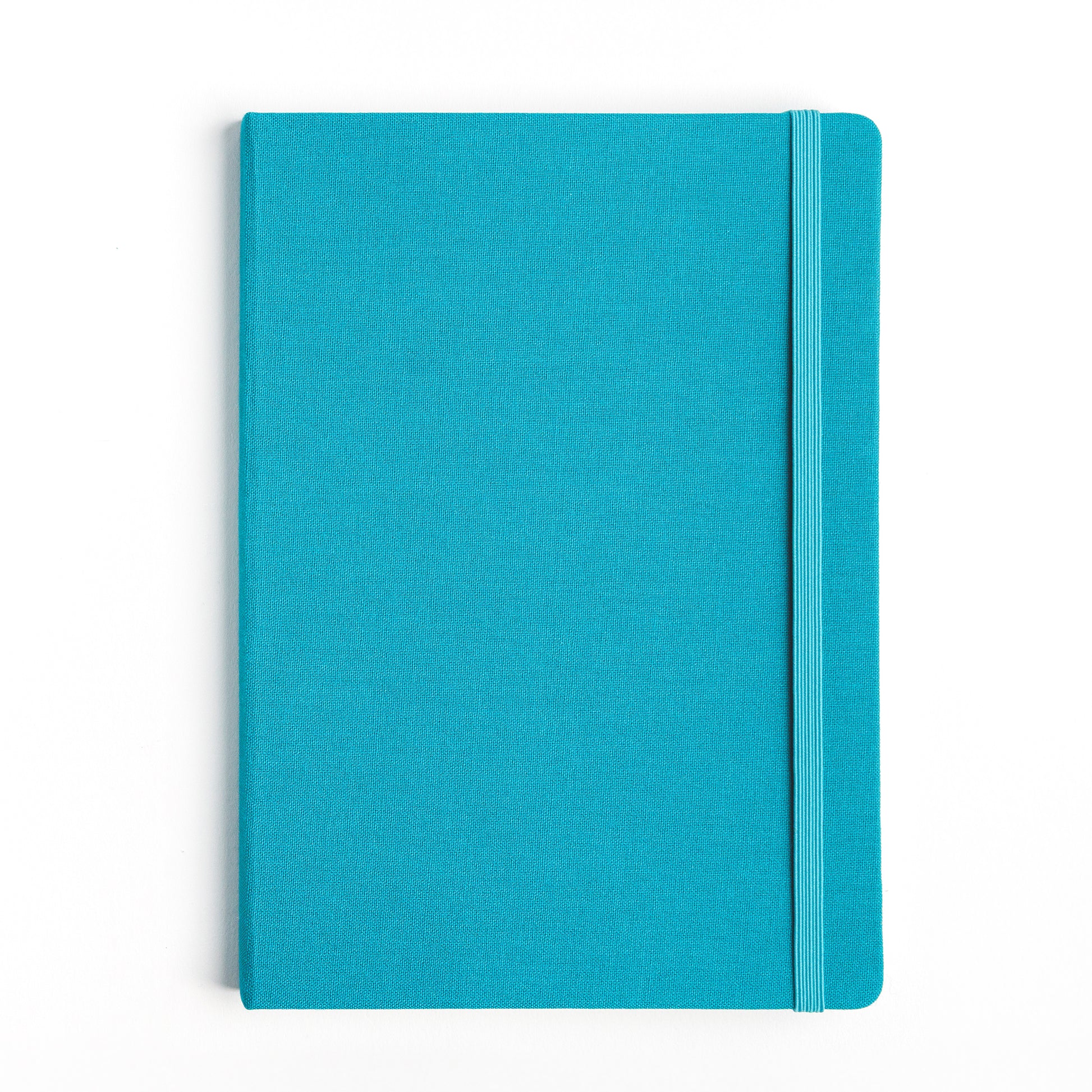 Teal hardcover cloth bound sketchbook with elastic closure on a white background