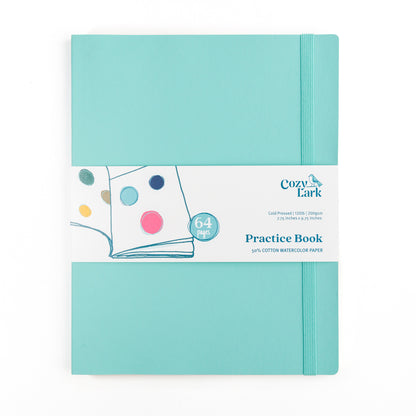 Turquoise soft cover practice book with Cozy Lark belly band on a white background