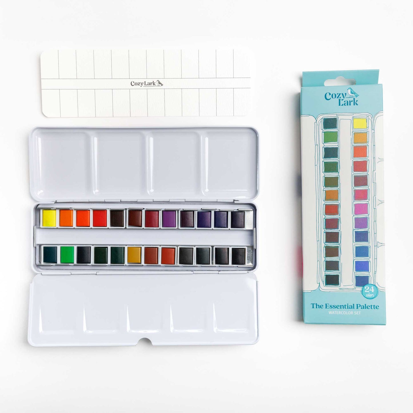 24-color Watercolor paint set with open palette, swatch card and packaging on a white background.