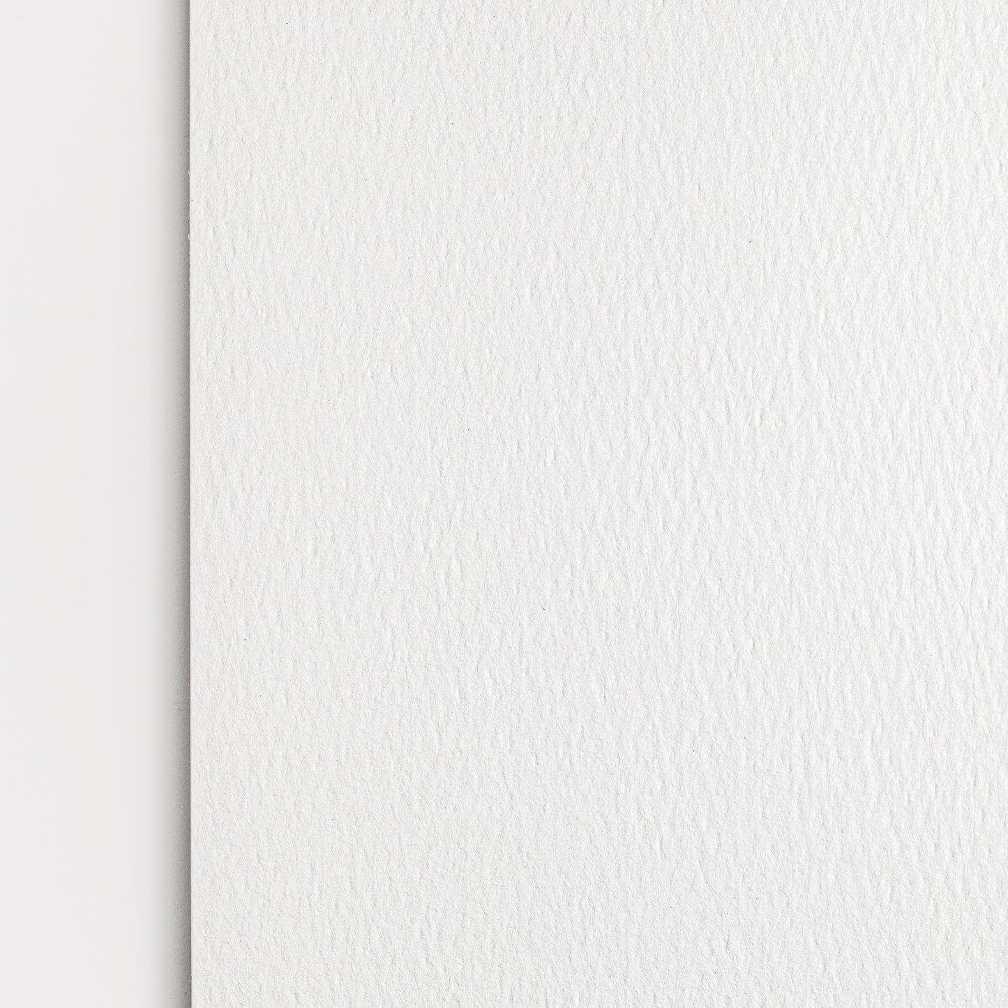 Detail close up of watercolor pad paper showing the paper texture and natural white color. 