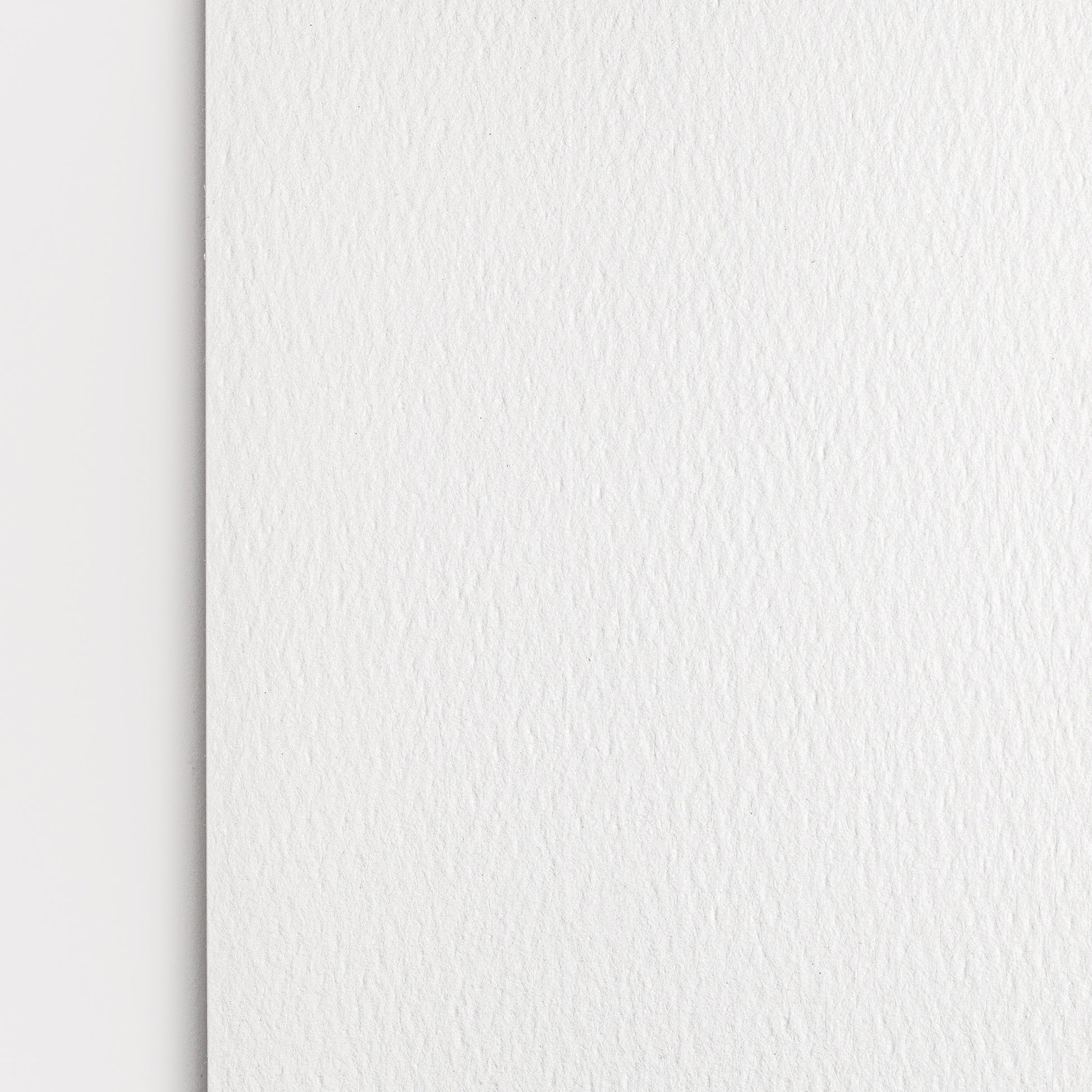 Detail close up of watercolor pad paper showing the paper texture and natural white color. 