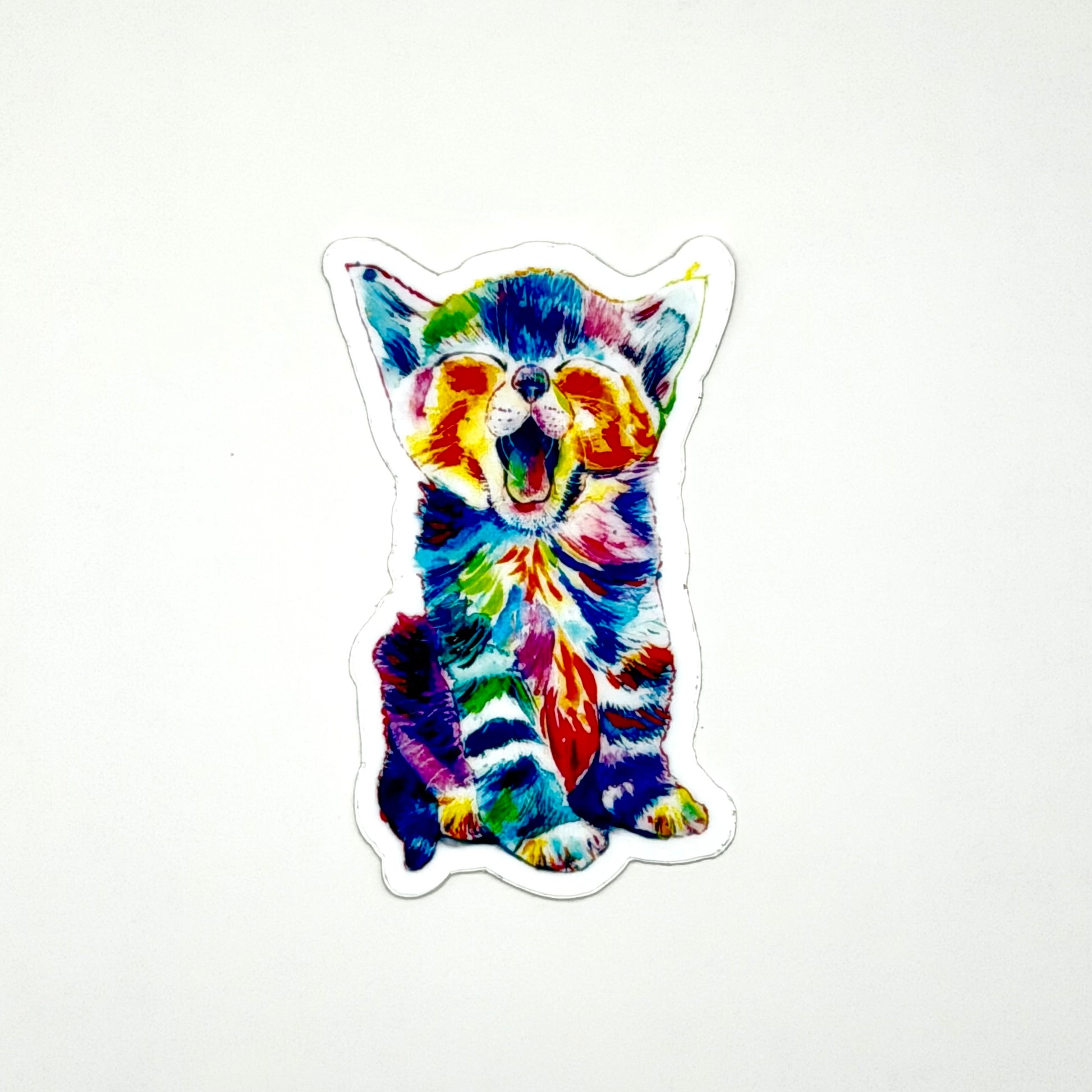 Colorful rainbow cat-shaped sticker on a white background