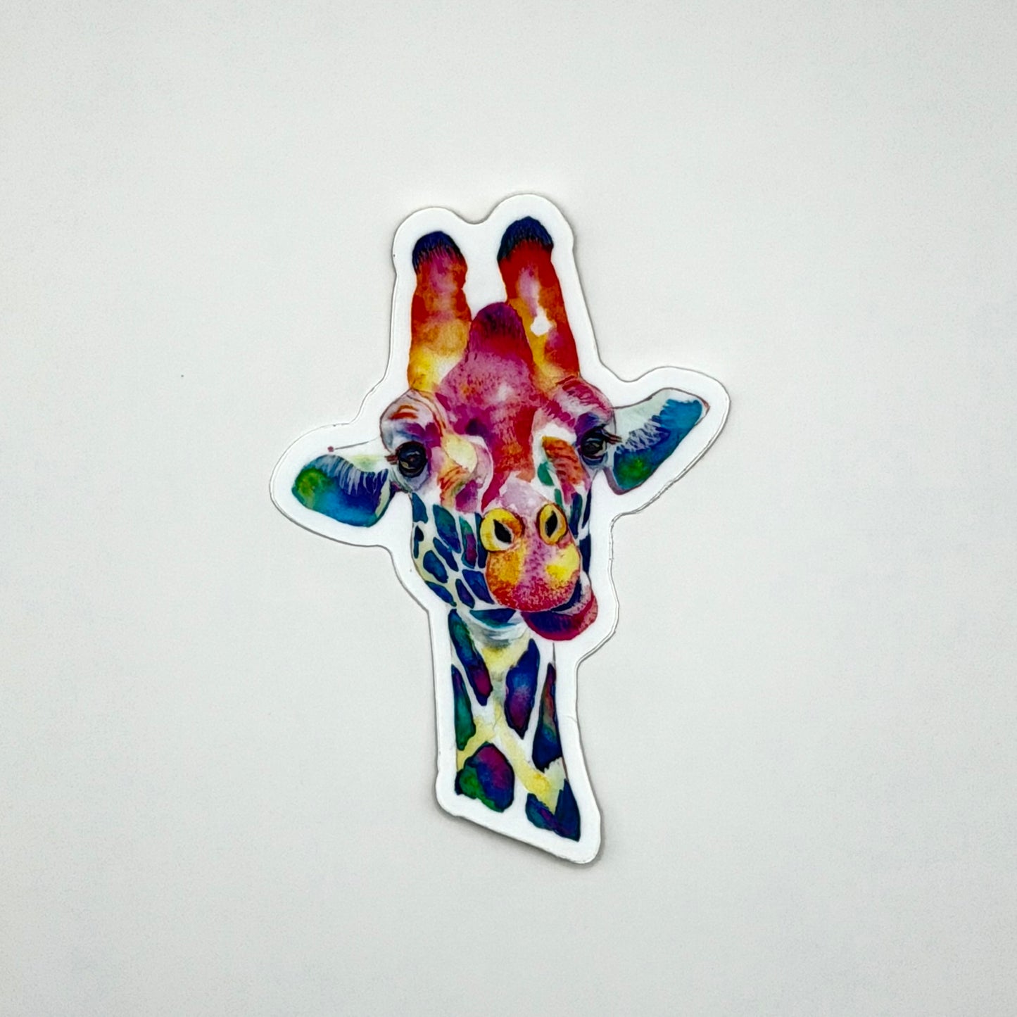 Colorful giraffe-shaped sticker on a white background