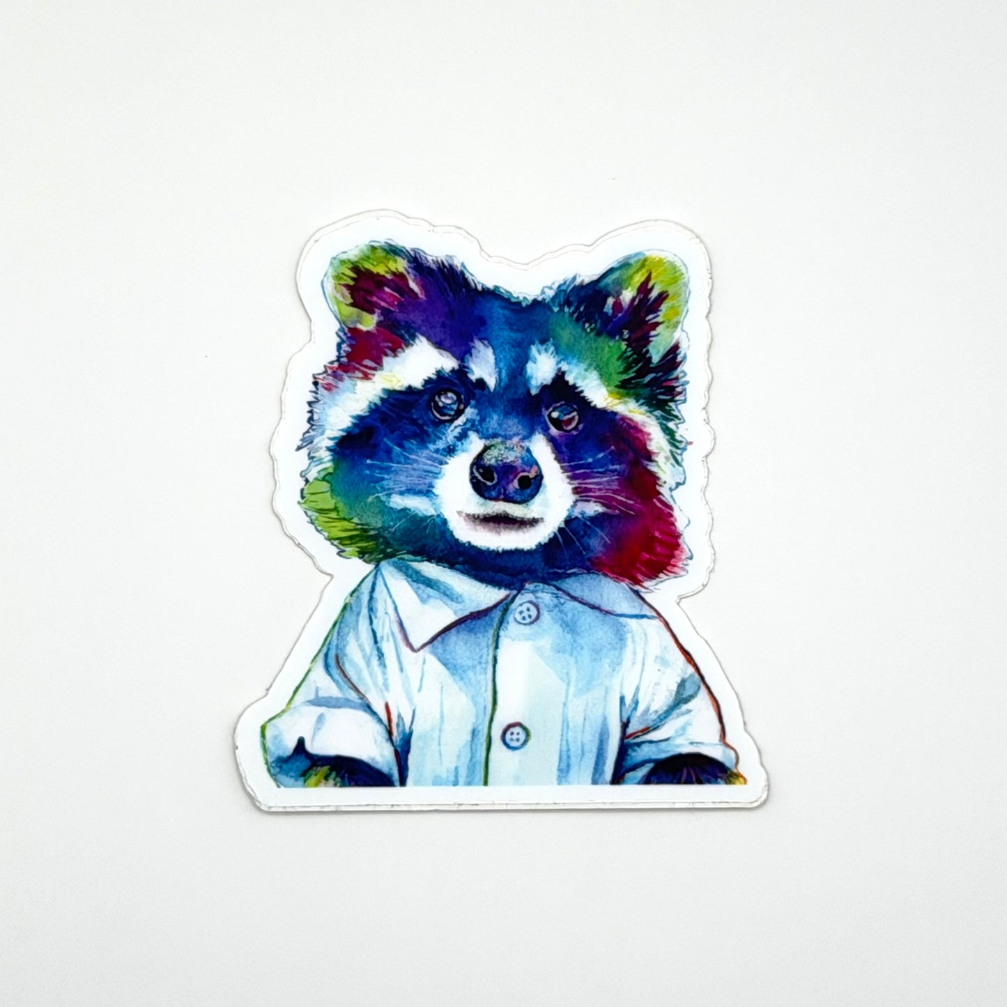 Colorful raccoon sticker with a blue work shirt on a white background